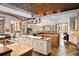 Open-concept kitchen featuring granite countertops, island sink, and seamless flow to living spaces at 10231 Democrat Rd, Parker, CO 80134