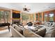Cozy living room with fireplace, large windows with scenic views, and comfortable seating at 10231 Democrat Rd, Parker, CO 80134