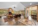 Spacious living room with a fireplace, lots of seating, and an amazing view of the surrounding forest at 10231 Democrat Rd, Parker, CO 80134
