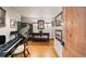 Interior room featuring a keyboard, console table, and screen; ready for relaxing at 10231 Democrat Rd, Parker, CO 80134