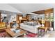 Spacious living room with an open concept floor plan and lots of seating at 10231 Democrat Rd, Parker, CO 80134