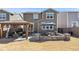 Inviting backyard with gazebo, patio seating, and an umbrella-covered dining table at 10597 Casper St, Parker, CO 80134