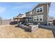 Spacious backyard with a patio, pergola, and outdoor dining area, ideal for outdoor gatherings and relaxation at 10597 Casper St, Parker, CO 80134