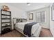 Cozy bedroom with natural light, a bookshelf, and a comfortable bed at 10597 Casper St, Parker, CO 80134