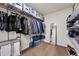 Walk-in closet is equipped with shelving, hanging racks, and ample storage space at 10597 Casper St, Parker, CO 80134