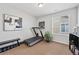 Home exercise room featuring a treadmill, bench, and weights, perfect for staying active at 10597 Casper St, Parker, CO 80134