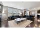 Bright living room with hardwood floors, modern decor, and large windows providing ample natural light at 10597 Casper St, Parker, CO 80134