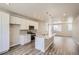 Open concept kitchen with island, granite countertops, and stainless steel appliances at 6890 Merseyside Ln, Castle Pines, CO 80108