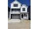 Charming two-story home boasts a modern farmhouse design, two-car garage, and covered front porch at 6657 E 149Th Dr, Thornton, CO 80602