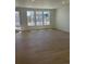 Bright living area featuring lots of natural light and beautiful wood flooring at 6657 E 149Th Dr, Thornton, CO 80602