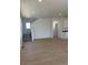 Spacious living area with wood floors, staircase, neutral paint, and recessed lighting at 6657 E 149Th Dr, Thornton, CO 80602