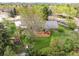 Aerial view of the home showcasing the expansive backyard with a large deck and lush greenery at 1800 S Niagara Way, Denver, CO 80224