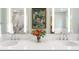 Bright bathroom showcasing a double sink vanity with chrome faucets, perfect for a Gathering at 1800 S Niagara Way, Denver, CO 80224