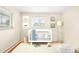 A bright Bedroom with a white crib, soft rug, and calming decor creating a soothing space at 1800 S Niagara Way, Denver, CO 80224
