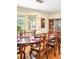Formal dining room featuring an elegant table, chandelier, and large windows at 1800 S Niagara Way, Denver, CO 80224