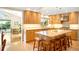 This updated kitchen has custom wood cabinets, stainless appliances, granite countertops and convenient seating at 1800 S Niagara Way, Denver, CO 80224