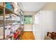 Well-organized pantry with shelving and a refrigerator, providing ample storage space at 1800 S Niagara Way, Denver, CO 80224