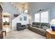 Inviting living room showcasing high ceilings, neutral tones, and comfortable seating arrangements at 10554 Tracewood Cir, Highlands Ranch, CO 80130
