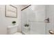 The bathroom has a shower with glass doors and a low-flow toilet at 10185 W 25Th Ave # 31, Lakewood, CO 80215