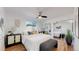 This bedroom boasts wood floors, a ceiling fan, and large closets with mirrored doors at 10185 W 25Th Ave # 31, Lakewood, CO 80215
