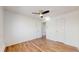 This bedroom features wood floors, a ceiling fan, and white walls at 10185 W 25Th Ave # 31, Lakewood, CO 80215