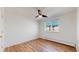 This bedroom features wood floors, a ceiling fan, and large windows at 10185 W 25Th Ave # 31, Lakewood, CO 80215