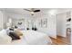 This bedroom boasts wood floors, a ceiling fan, and large closets with mirrored doors at 10185 W 25Th Ave # 31, Lakewood, CO 80215