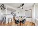 Dining area with a modern table, stylish chairs, and a view into the kitchen, creating an inviting space at 10185 W 25Th Ave # 31, Lakewood, CO 80215