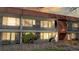Two-story townhouse showcasing balconies and a privacy fence, offering a blend of indoor-outdoor living and neighborhood charm at 10185 W 25Th Ave # 31, Lakewood, CO 80215