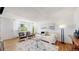 Bright living room with stylish decor, including a plush sofa, decorative pillows, and a modern area rug at 10185 W 25Th Ave # 31, Lakewood, CO 80215