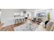 Inviting living space with open layout, seamlessly connecting living room, dining area, and modern kitchen at 10185 W 25Th Ave # 31, Lakewood, CO 80215