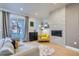 Comfortable living room with a fireplace, large windows, and access to the backyard at 1439 Garfield St, Denver, CO 80206