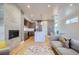 Bright living area with a fireplace, modern kitchen, dining area and hardwood floors at 1439 Garfield St, Denver, CO 80206