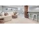 Finished basement with a seating area, bar, and light gray walls at 1395 S Josephine St, Denver, CO 80210