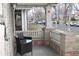Cozy front porch with brick accents and comfortable seating to enjoy the outdoors at 1395 S Josephine St, Denver, CO 80210