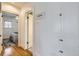 Hallway featuring hardwood floors and built-in storage at 1395 S Josephine St, Denver, CO 80210