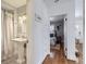 Hallway showcasing the bathroom and bedroom, highlighting the home's layout at 1395 S Josephine St, Denver, CO 80210