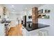 Well-appointed kitchen with black countertops, an island, and stainless steel appliances at 1395 S Josephine St, Denver, CO 80210