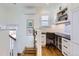 Cozy office nook featuring hardwood floors, built-in shelving, and natural light at 1395 S Josephine St, Denver, CO 80210