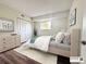 Cozy bedroom with a comfortable bed, dresser, and sliding door closet, providing ample storage space at 50 E Highline Cir # 101, Centennial, CO 80122