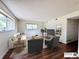 Bright living room featuring hardwood floors, two windows, and tastefully chosen furniture and decor at 50 E Highline Cir # 101, Centennial, CO 80122