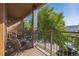 Private balcony with seating area overlooking tree tops at 427 S Quay St, Lakewood, CO 80226