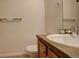 Clean bathroom with a single sink vanity and a toilet at 427 S Quay St, Lakewood, CO 80226