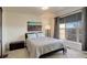 Comfortable bedroom with a queen bed and large window at 427 S Quay St, Lakewood, CO 80226