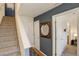 Bright entryway with staircase, mirror, and doors to other rooms at 427 S Quay St, Lakewood, CO 80226