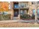 Attractive townhome exterior with fall foliage and a welcoming entrance at 427 S Quay St, Lakewood, CO 80226