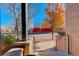 View from front steps showing a quiet street and autumn leaves at 427 S Quay St, Lakewood, CO 80226