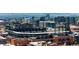 Aerial view showcasing baseball stadium nestled within the city skyline at 2261 Blake St # 2G, Denver, CO 80205