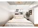 Neutral bedroom featuring hardwood flooring, decorative artwork, and lamps for a soft ambiance at 2261 Blake St # 2G, Denver, CO 80205