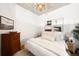 Bedroom featuring hardwood flooring, neutral paint, decorative artwork and lamps creating a soft ambiance at 2261 Blake St # 2G, Denver, CO 80205